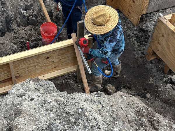 Crew assembling foundation formwork at the Block Forever project