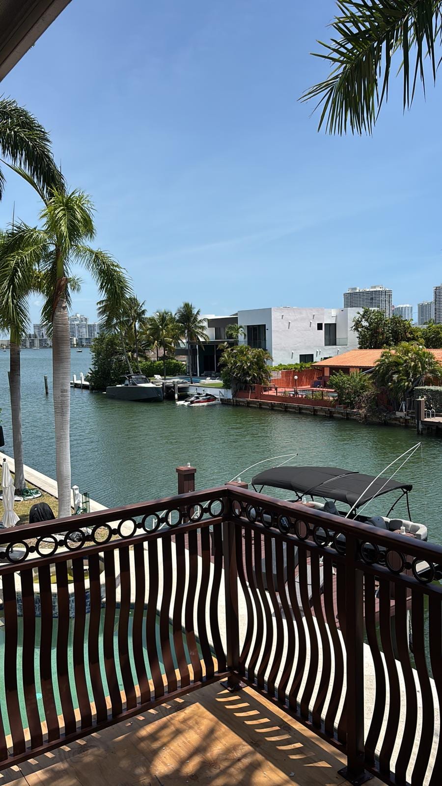 View from the new balcony over the intracoastal waterway, boats, and neighboring waterfront homes